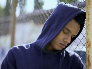 young man in blue | ASAP Bail Bonds Houston